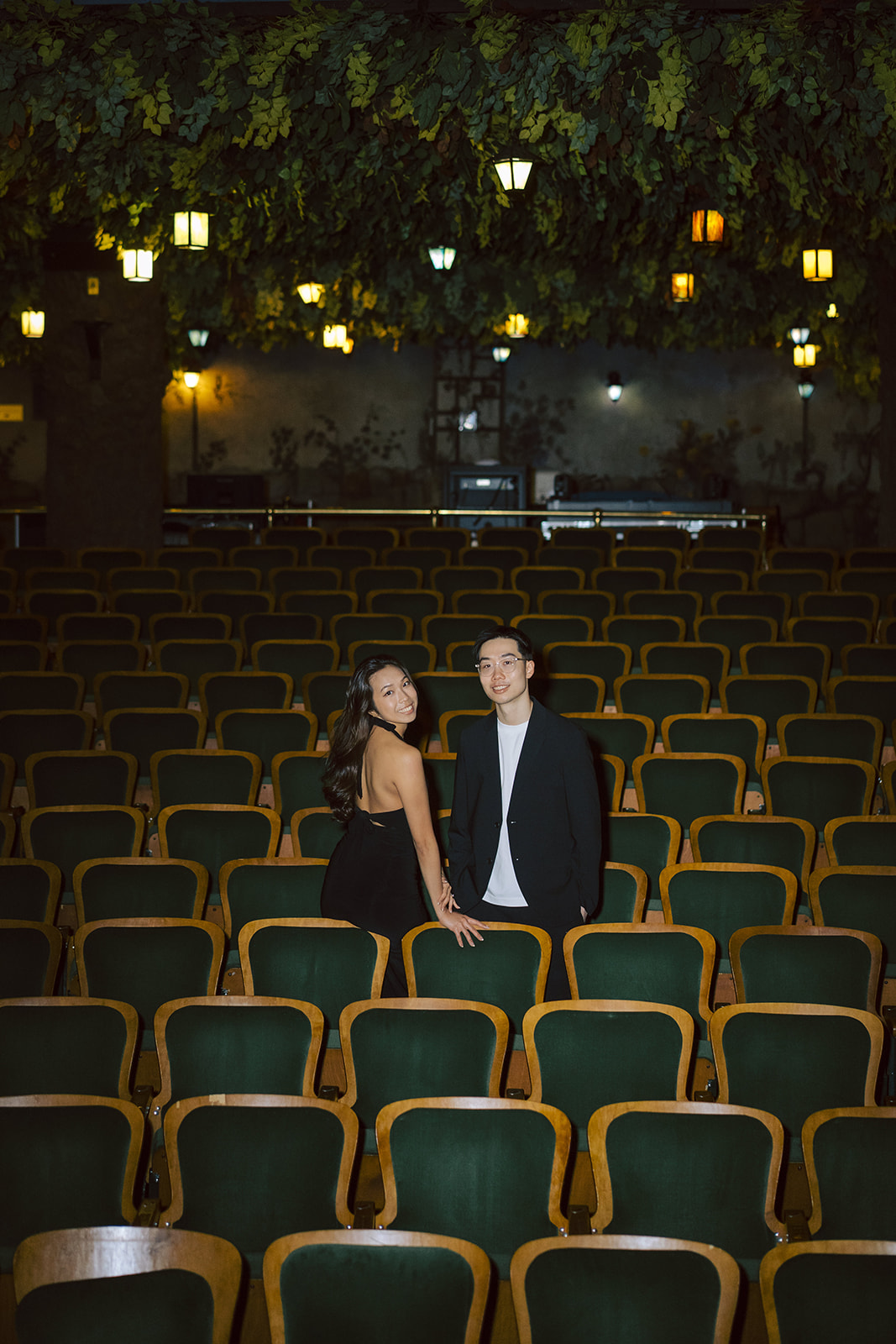 Bryan and Sheryl standing together among the theatre seats